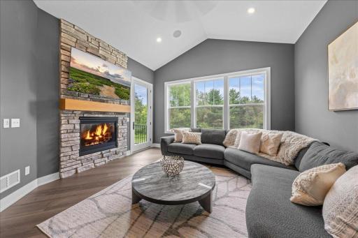 Just off the kitchen you will find this 4 season porch with vaulted ceiling and access to the deck. A gas fireplace for your enjoyment. A great space to cozy up.