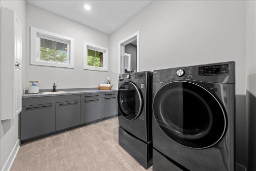 Just off the Primary closet, you will find this beautiful Laundry room