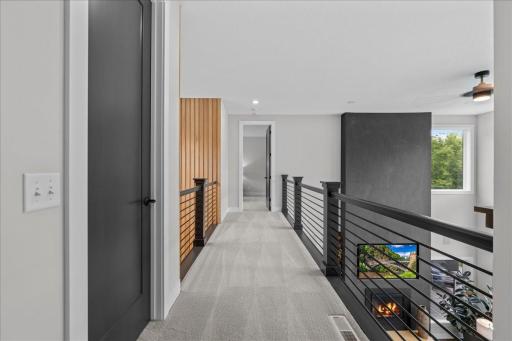 Off the loft is the catwalk overlooking the Main Level living room and Foyer, and provides access to bedroom 4 with it's own private bathroom