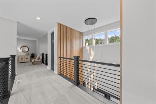 Notice the beautiful chandelier and transom windows; great function providing design and art all in one
