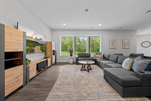 Moving to the Lower Level is a fabulous gathering room looking onto the back patio and yard. The gathering spaces all have sound system and great lighting.