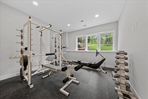 Lower Level Work out room with ideal rubber flooring. This room has a designated closet space and Electrical outlet in the wall for TV. It could easily be a 6th bedroom