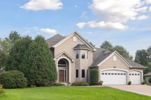 Lovely 2-story tucked into corner lot in Autumn Woods