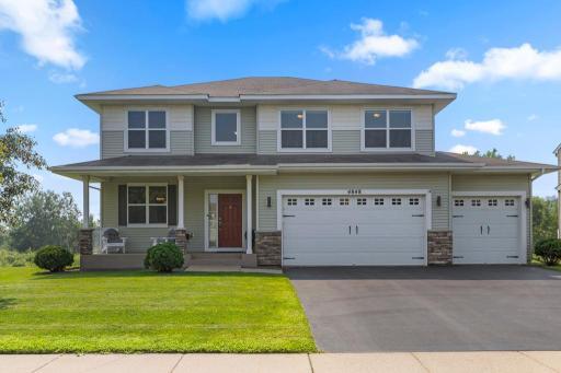 Beautifully maintained two-story home with a 3-car garage and inviting front porch, backing up to Deans Lake in Shakopee. Conveniently located near the new entertainment district surrounding Canterbury