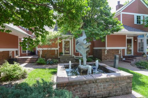 Serene central fountain welcomes you home each day with tranquil charm.