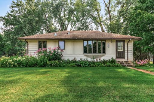 Welcome home to your Coon Rapids retreat! Nestled on a private and spacious 0.57-acre corner lot, this property is surrounded by mature trees and lush landscaping—your own peaceful haven near the city.