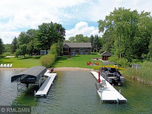 A stunning view greets you from the water, showcasing the beauty of the property from the lake.