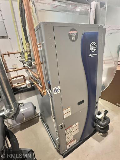 There are two separate utility rooms; this one houses the HVAC system.