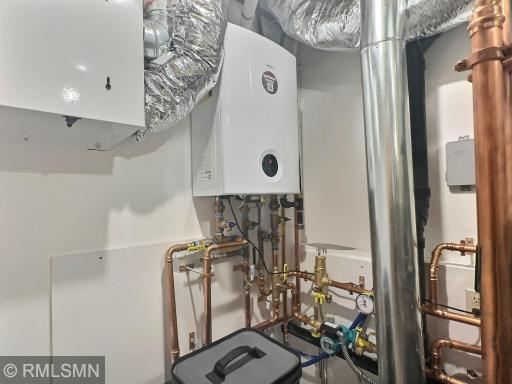Located here is the in-floor heating mechanics and a tankless water heater. Never run out of hot water again.