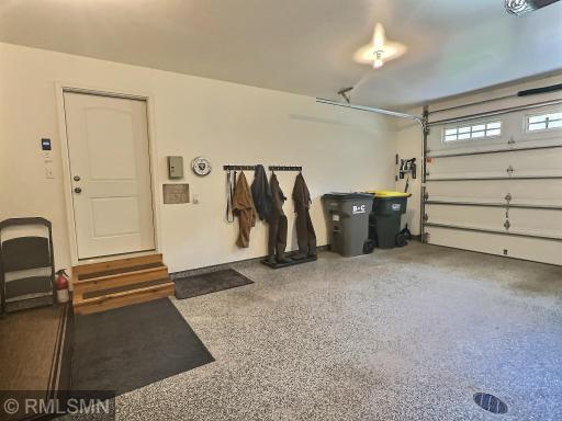 The first two stalls of the attached garage boast heated aggregate flooring with a drain, with convenient access just off the foyer.