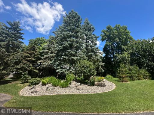 Tastefully designed and meticulously maintained landscaping surrounds the property.