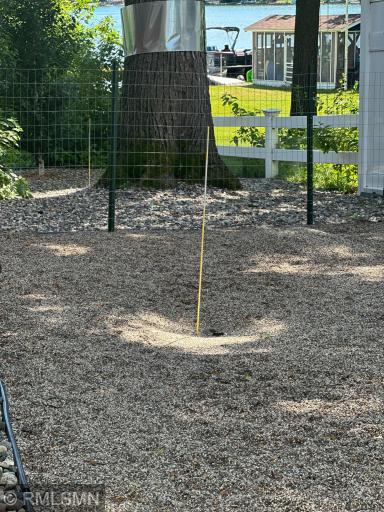 On the south side of the house, youâll find a fenced-in dog walk for your furry friends. Filled with pea gavel with an automatic washing system, it provides a convenient place for pets to 'go' without owners having to clean up.