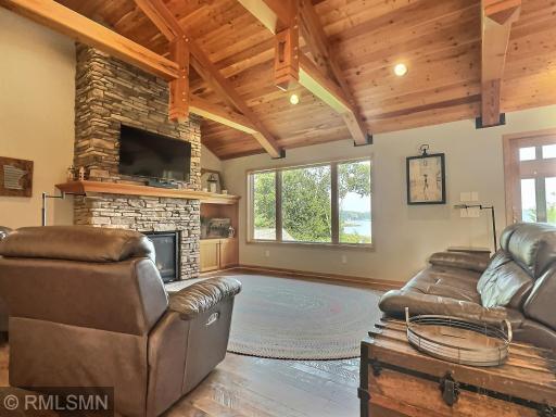 Gleaming Hickory rough-hewn flooring stretches across the main floor, complemented by Douglas fir posts and beams that add a warm, rustic charm.