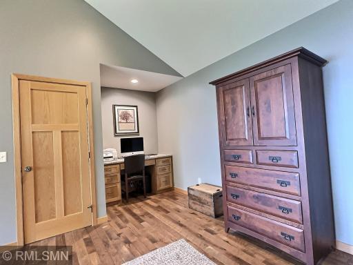 The built-in Hickory desk and work area in the bedroom provide a perfect spot to keep your private documents organized.