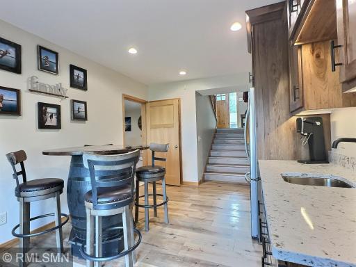 Perfectly sized for intimate gatherings, this wet bar keeps the fun flowing. For larger parties, step right outside to the patio or into the spacious family room next door!
