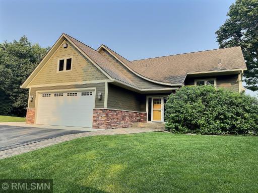 A dream lake home offering the best of both worlds â upscale living and cozy charm, all on a level lot with a pristine sandy beach.