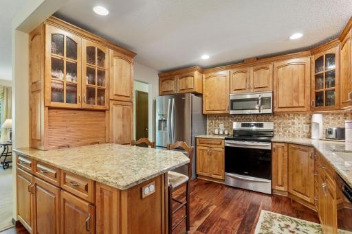 Beautifully remodeled kitchen includes Cambria counter tops, tile back splash and beautiful/durable upgraded flooring!