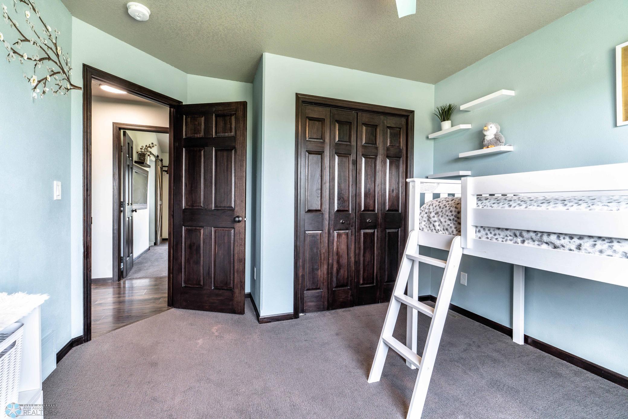 Custom Closet Shelving Behind These Doors