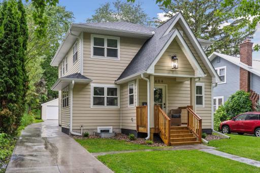The oversized garage tucked behind the home offers ample space and EV readiness.
