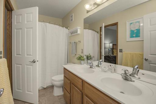 Walk-through full bath includes dual vanities