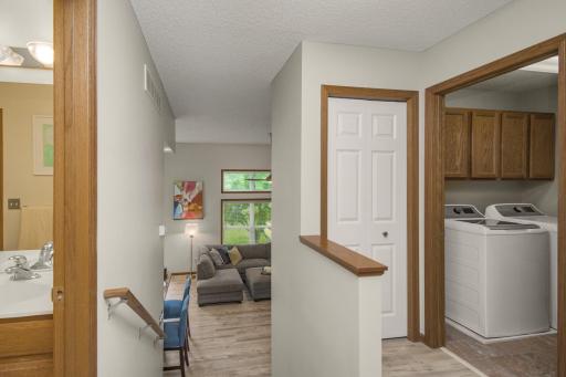 Upstairs, you'll find two bedrooms, full bath, and laundry.