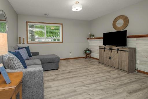 Lower level family room offers new flooring and plenty of space!