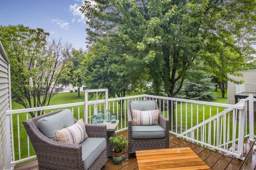 Deck boasts new maintenance-free deck boards and steps leading down to the backyard.