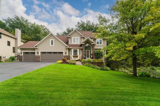 This CUDDIGAN-BUILT home offers a functional layout with spacious rooms and custom woodwork, all tucked onto a wooded, pondfront WALKOUT lot just steps from Glendale Elementary!