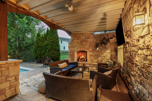 Rustic wood burning fireplace w/ stone surround and hearth