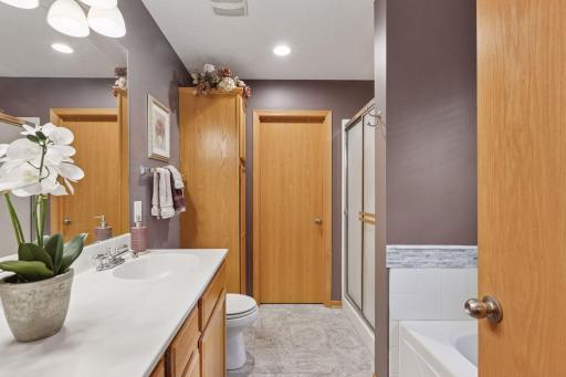 Full primary bath with separate tub and shower and access to walk-in closet
