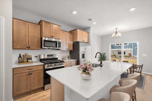 Kitchen with center island- staged. Not actual but similar.