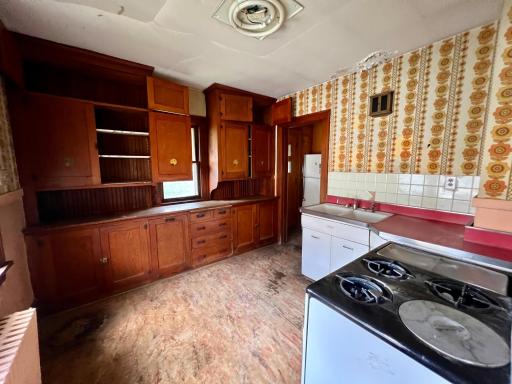 Check out the sweet artwork on the vintage cabinetry!