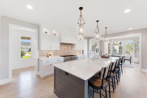 Breakfast bar seating and storage on both sides of the center island