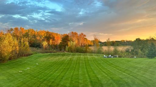 Seasonal view of sunrise overlooking the backyard