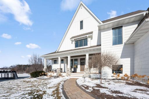 Brick paver walk leads you to the large front porch