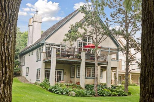 The walkout on the lower level offering enchanting hosta gardens and expansive lawns