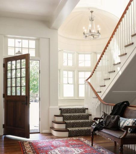 Thoughtfully designed to make a statement from the moment you step inside—this is just one example of what could be built on this exceptional White Bear Lake lot. Photo of a foyer designed and built by BCD Homes.