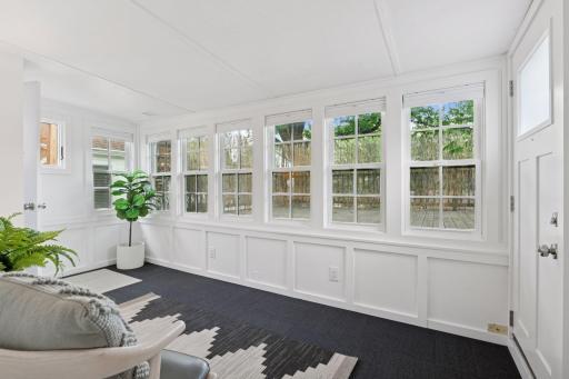 Step out to the back deck just off the sunroom and kitchen- very convenient for grilling!