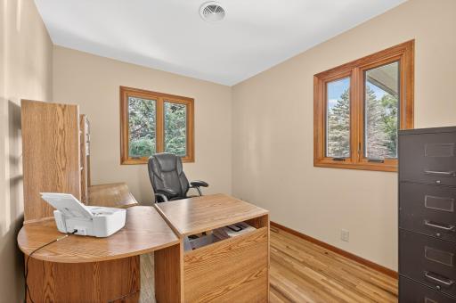 Bedroom three is currently furnished as a main level, home office.