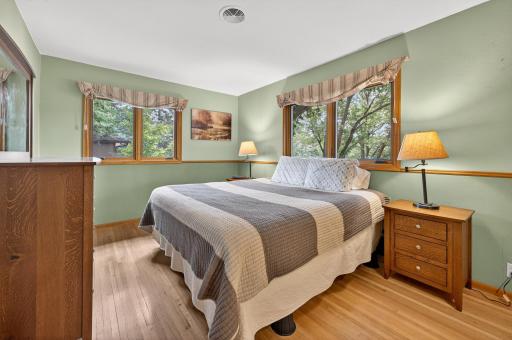 The Primary Bedroom is one of four main level bedrooms. The gleaming hardwood floors are spotless.