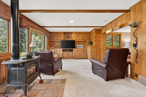 A wall of custom crafted cabinets creates an ideal entertainment center.