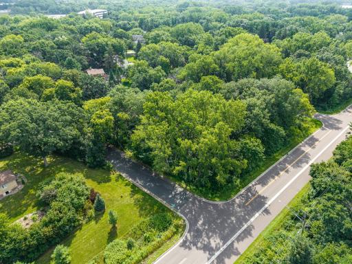 Wooded buildable lot - see city of Arden Hills for any restrictions.