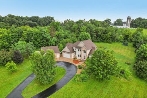 Exquisite retreat perfectly nestled on a picturesque 5.09-acre private lot.