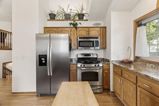 Beautiful oak cabinetry, stainless appliances complete