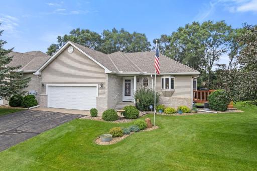 Welcome to 13446 Buchanan St NE, a beautifully maintained twin home located on a quiet cul-de-sac.