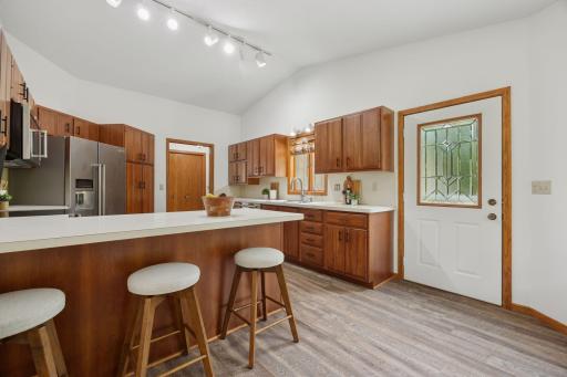 Culinary luxury with backyard views and abundant natural light.