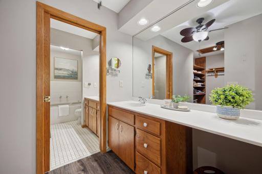 Spa-inspired ensuite bathroom features high-end tile and modern fixtures.