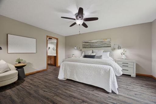 Lavish primary suite with tranquil views of surrounding wetlands.