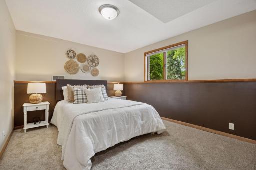 Generously sized guest bedrooms with large closets and soft natural light.