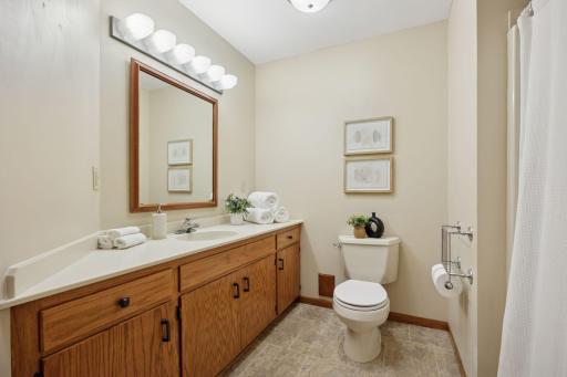Modern bathrooms with elegant tile work and updated vanities.